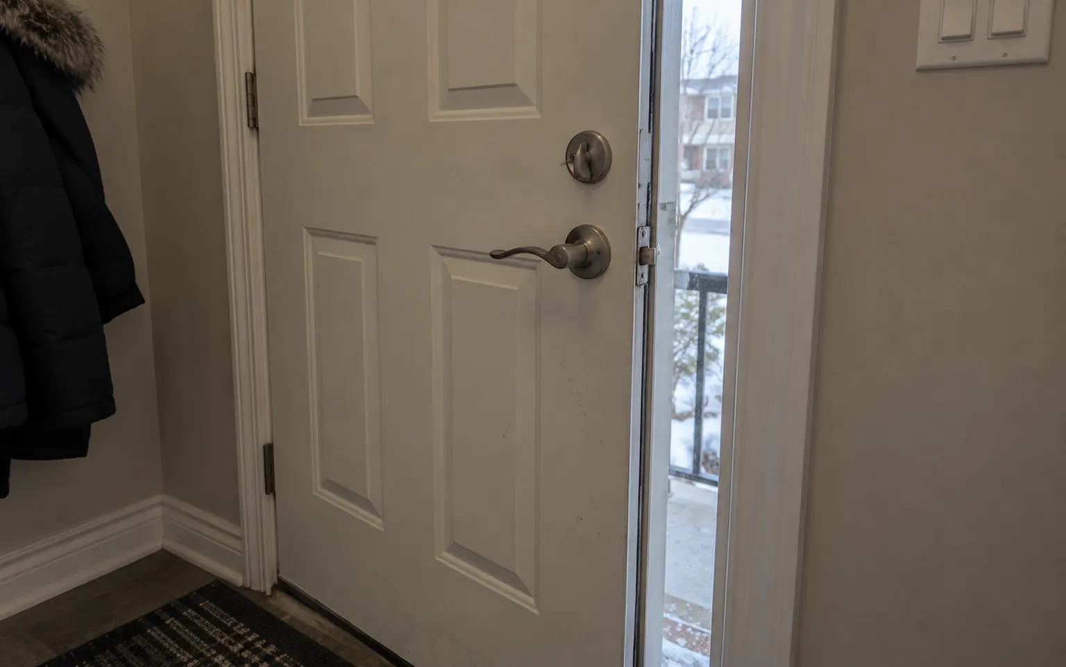Door standing slightly open with the latch bolt visible