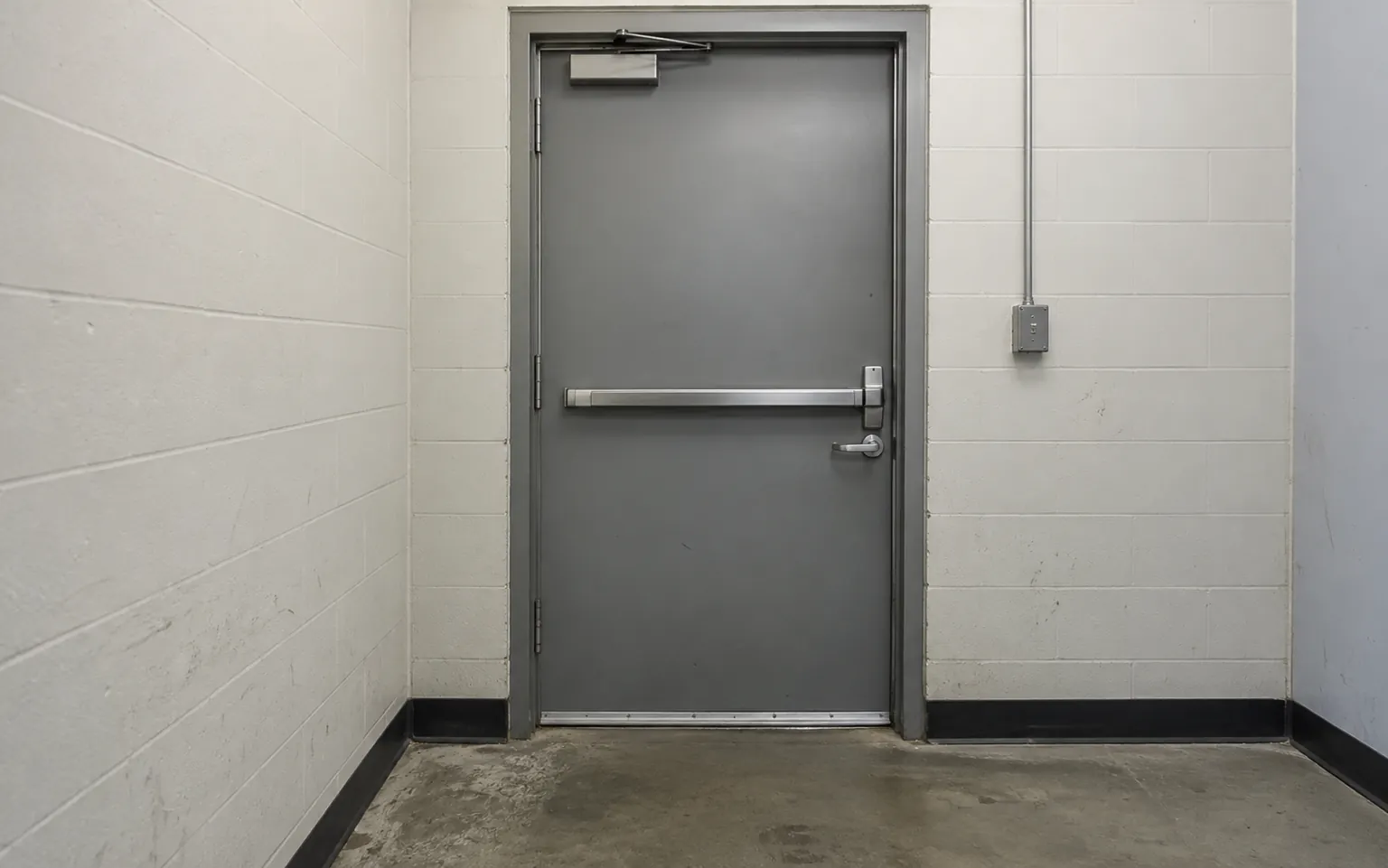 Commercial steel door with a lever lock